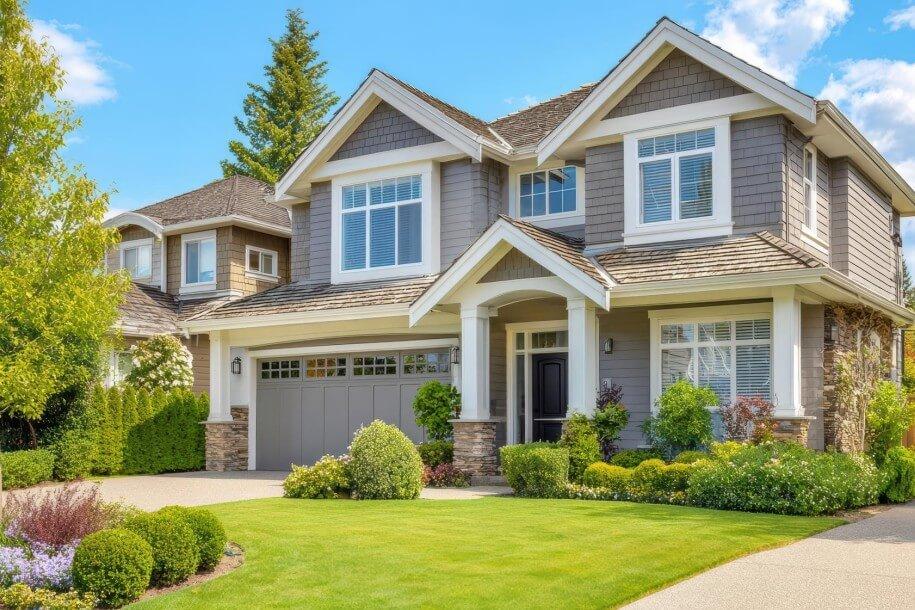 beautiful modern suburban home with manicured lawn