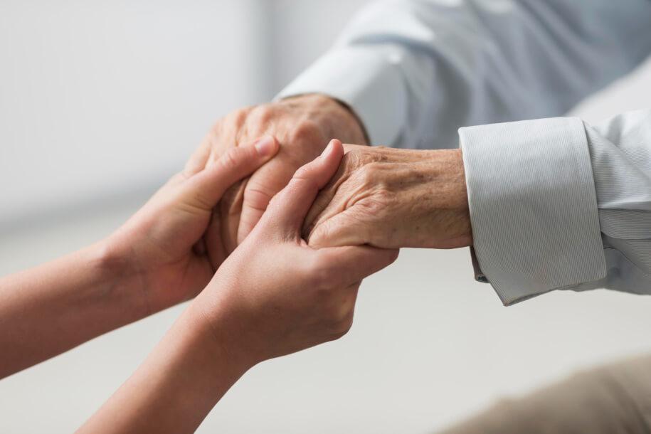 elderly care holding senior man hands
