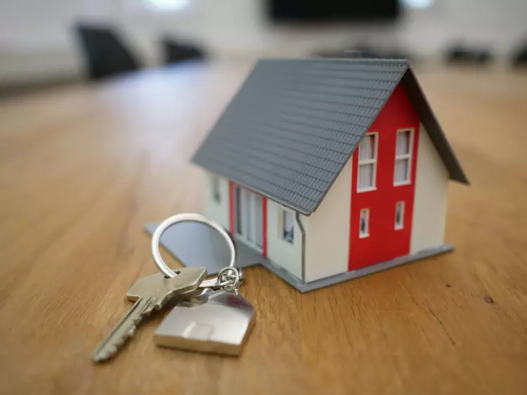 Small house next to key chain