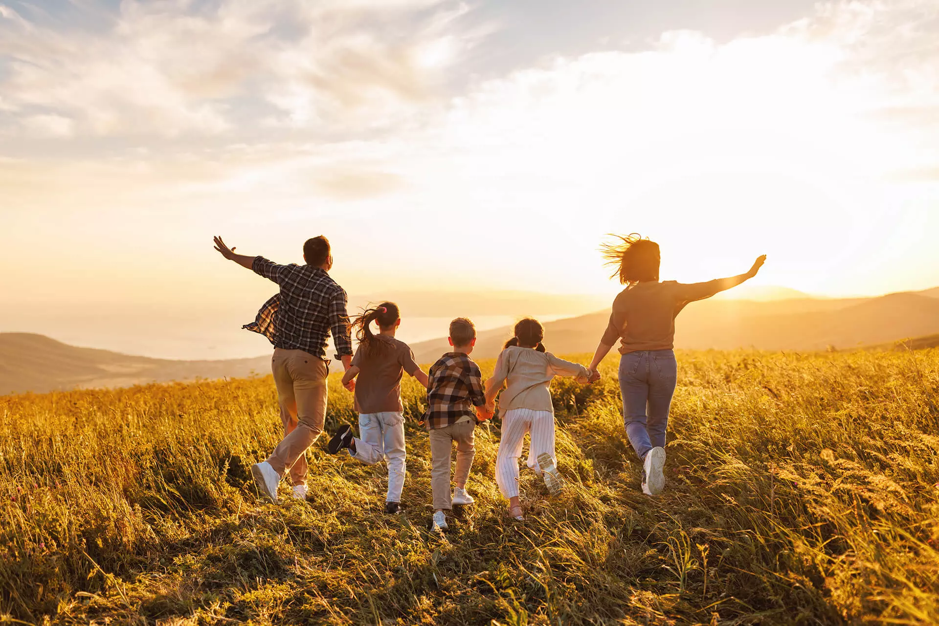family running in a field
